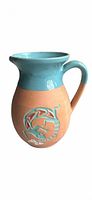 Full view of terracotta pitcher vase with turquoise glaze and Southwestern motif