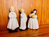 Front view of all three Royal Doulton figurines