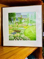 Full view of framed watercolor on shelf