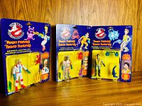 All three sealed figures on cards