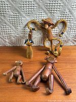 Group shot of all five wood animal figures