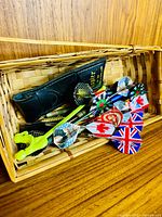 Basket holding darts and slip case