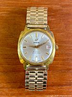 Front view of watch showing dial, case and bracelet