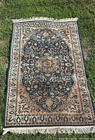 Full view of rug showing pattern and fringe