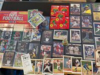 Overview showing sealed Score NFL set box, five sealed Fleer ’93 packs and numerous sleeved cards