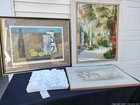 Group shot of all four framed artworks on table