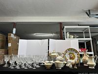 Group shot of crystal stemware and porcelain pieces on table