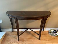 Front view of demi-lune console table