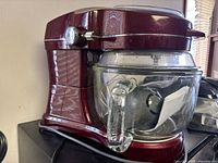 Side view of burgundy Kenmore stand mixer with glass bowl attached