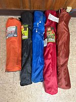 Five folded chairs in carry bags, showing all items