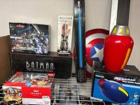 Group shot of all boxed items and loose shield and rocket