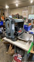 Front and left side view of King Industrial planer on workbench