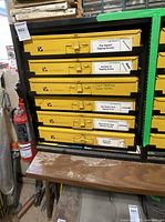 Full view of Kar Products cabinet with visible drawers and fire extinguisher beside