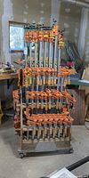 Front view of cart showing pipe clamps and tiers of F clamps