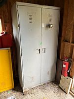 Front view of gray metal locker cabinet with two vented doors