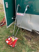 Full view of Mantis gas mini tiller standing upright