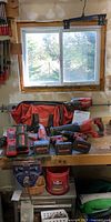 Workbench view of all tools, batteries, chargers and bag
