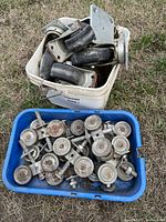 Bin of swivel casters and bin of sliding door rollers