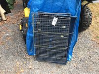 wire panels and plastic tray stacked and tied together