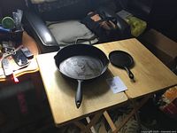 Top view of both cast-iron skillets showing interior surfaces and relative sizes