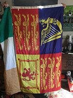 Royal Standard of UK flag fully displayed beside folded Irish flag