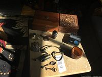 Closed view of both wooden boxes and assorted trinkets