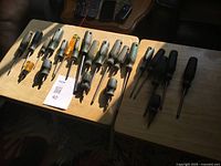 Full view of assorted screwdrivers on two tables
