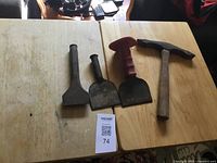 All four masonry tools on tabletop