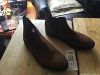 Full view of both boots on tabletop