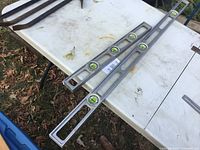 Both aluminum spirit levels on table