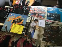 Front view of all seven LP jackets laid out