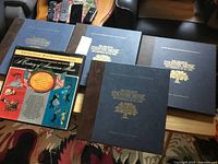 Five record sets on table: four Time Life country music binders, one Treasury of American Music box