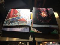 Stack of country vinyl LPs on table showing quantity