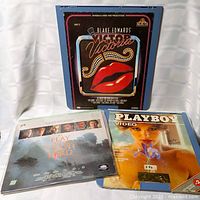 All three LaserDisc jackets standing together