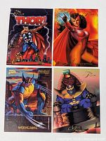 All four Marvel trading cards laid out