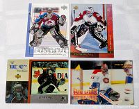 All four Patrick Roy hockey cards laid out on a table