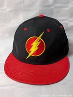 Front view showing Flash logo and red brim