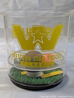 Front view showing Western Star Trucks Classic logo and football pieces inside base