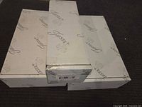 Three Fiesta-branded white boxes, two large one small