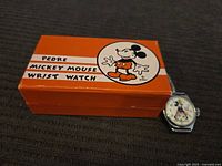 Watch with original orange box showing Pedre Mickey Mouse Wrist Watch graphics