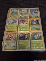 First nine-pocket binder page showing Lotad, Bulbasaur line, Venusaur, Chikorita and others