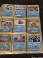 Binder page with nine water-type Pokémon cards including Walrein, Piloswine, Corsola, Toxapex