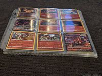 Binder page with nine Pokémon fire-type cards