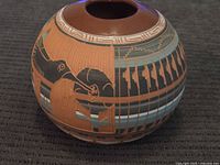 Front view showing animal motif and etched patterns