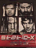 Full view of Static-X Machine poster showing four portrait panels and signatures