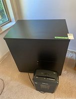 Front view of cabinet and shredder