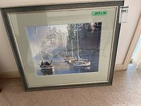 Full view of framed sailboat print showing frame, matting and size label