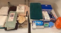 overview of towels, laundry and bathroom items on countertop