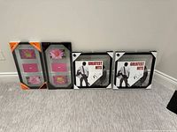 all four sealed Umbra frames lined against wall