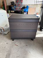 Front view of dark brown two-drawer nightstand
